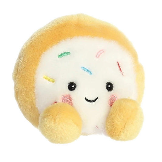 Front view thumbnail of the cute Crumble Cookie plush sitting straight, highlighting its dark safety eyes, small grin, and tiny golden-tan front feet.