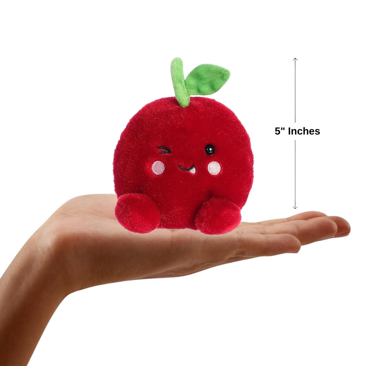 The 5-inch Aurora Palm Pals Cordial Cherry resting comfortably in the palm of a person's hand.