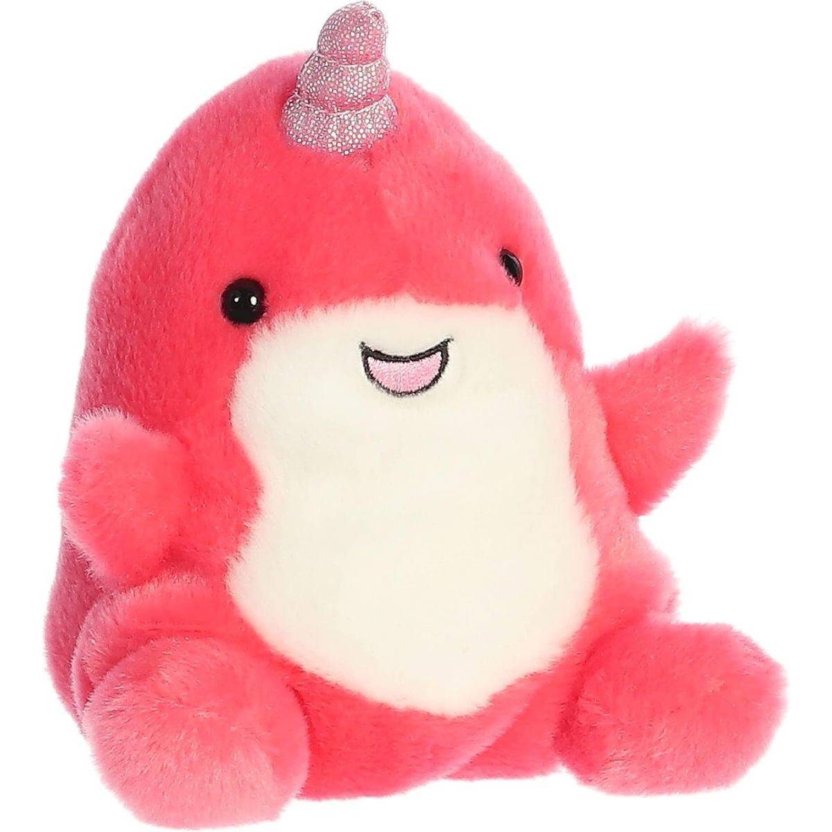 Aurora 5-inch Palm Pals Nia Narwhal plush toy showing its vibrant hot pink body, cream-white underbelly, small flippers, open stitched smile, and a glittering pink twisted tusk.