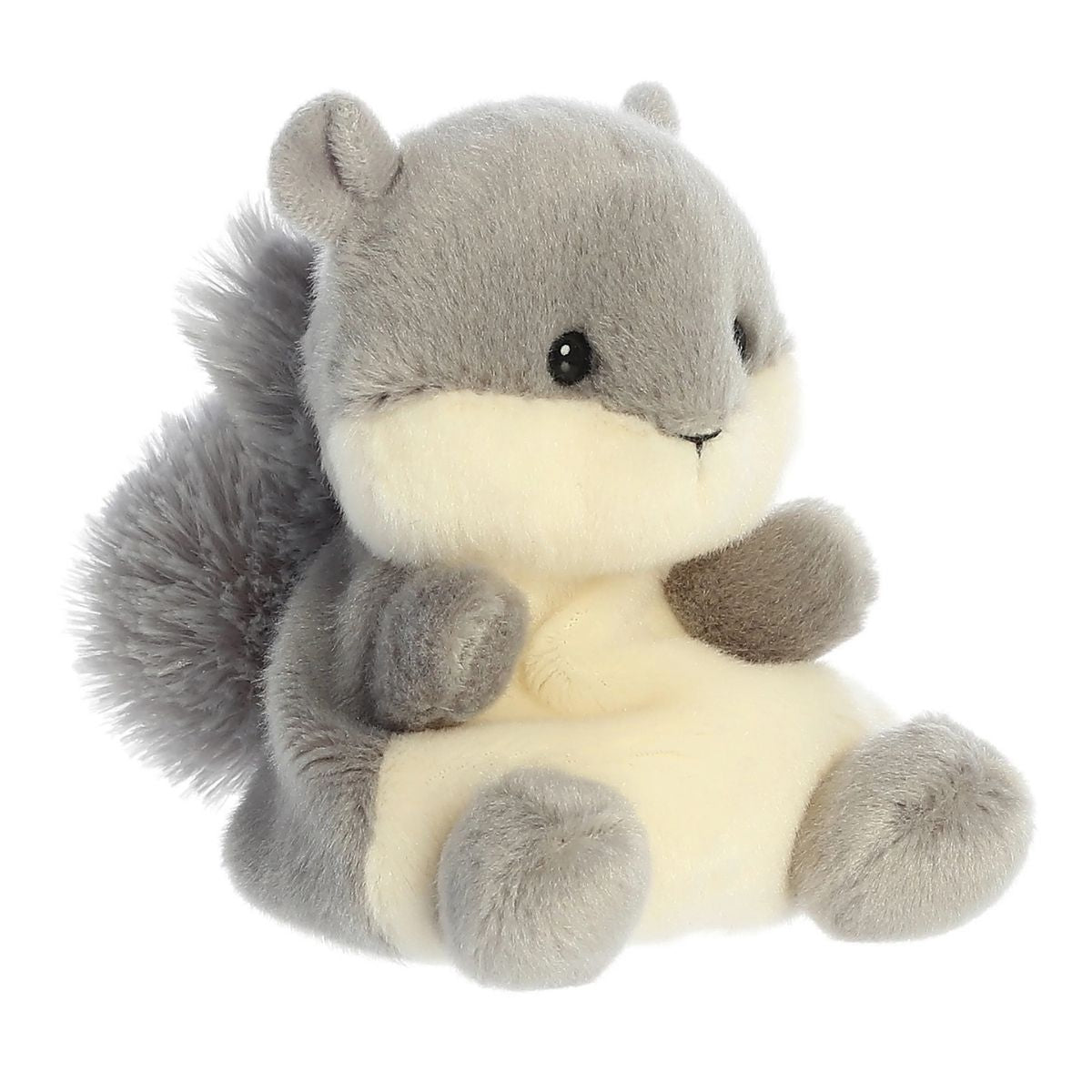 Aurora 5-inch Palm Pals Gus Grey Squirrel plush toy sitting at an angle showing its soft grey coat, cream underbelly and muzzle, and a large bushy grey tail.