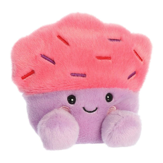 Aurora 5-inch Palm Pals Marzia Cupcake plush toy showing its fluffy hot-pink frosting with purple and red embroidered sprinkles, a lavender-purple wrapper base, and a happy smiling face with rosy cheeks.