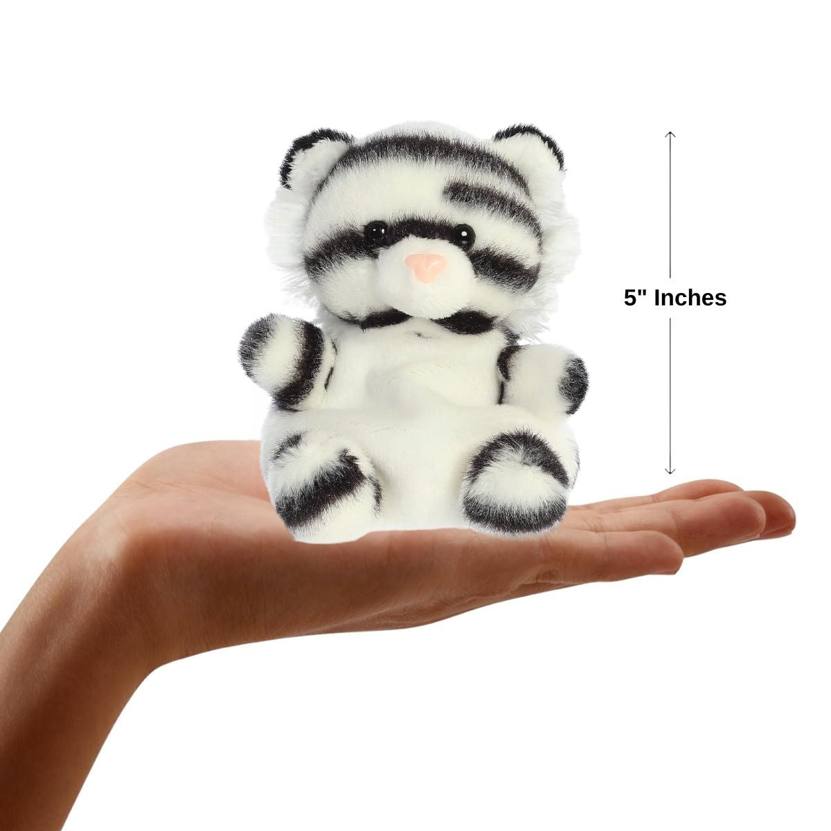 Sizing graphic showing the 5-inch Palm Pals Kira White Tiger sitting perfectly in the palm of a person's hand to demonstrate its miniature scale.