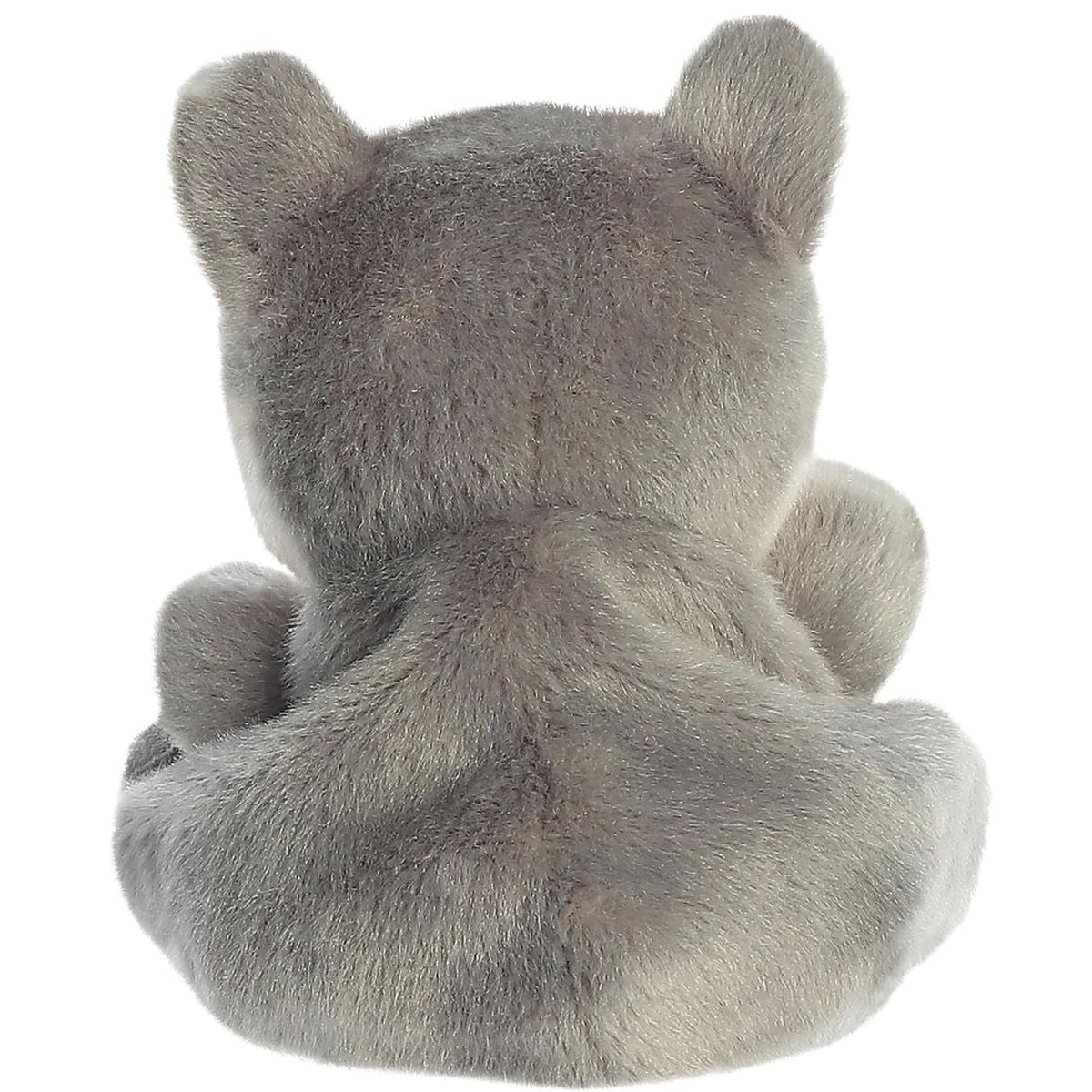Back view of the Aurora wolf plush showcasing his grey fur and little tail.