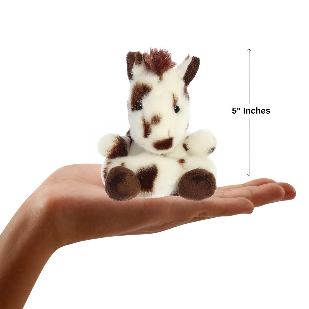 Lifestyle sizing graphic showing the 5-inch Aurora Palm Pals Haymitch Painted Horse sitting perfectly in the palm of a person's outstretched hand.