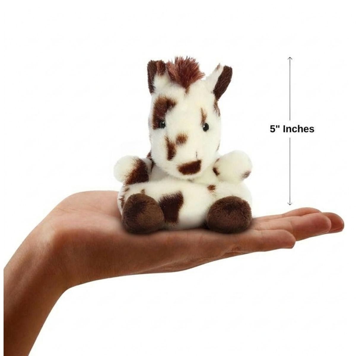Lifestyle sizing graphic showing the 5-inch Aurora Palm Pals Haymitch Painted Horse sitting perfectly in the palm of a person's outstretched hand.