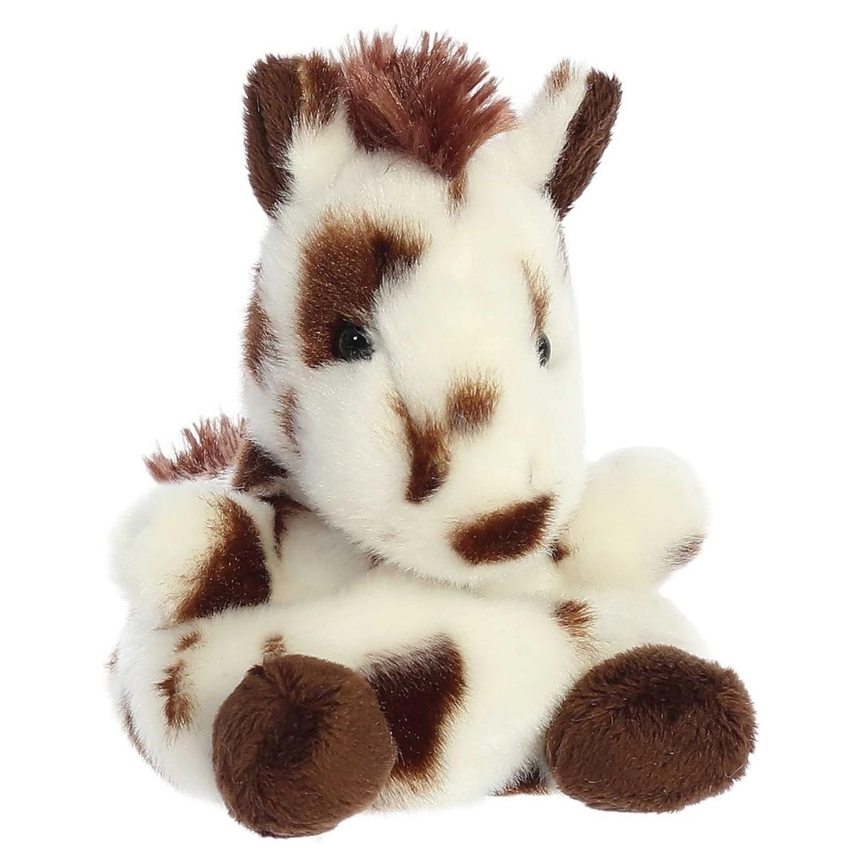 Front angled view of the Aurora Palm Pals 5-inch Haymitch Painted Horse plush sitting upright with white fur and brown spots.