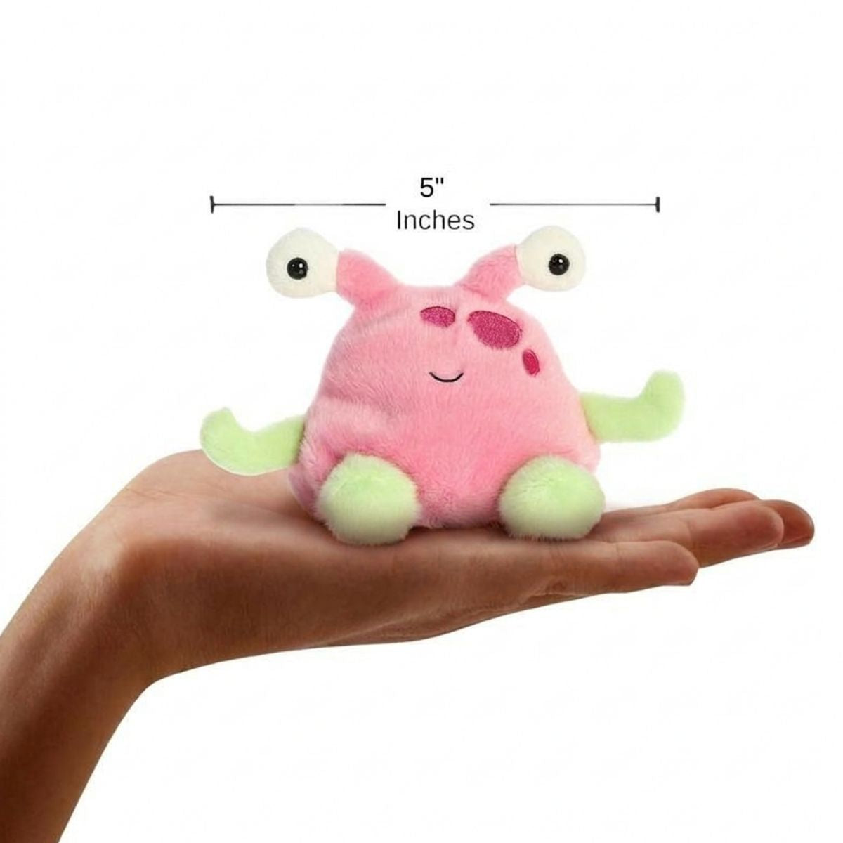 The miniature Silly Alien plush sitting balanced in an open human hand under a 5-inch height graphic indicator.