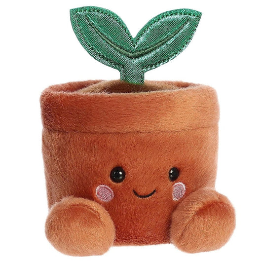 Angled front view of the 5-inch Aurora Palm Pals Terra Potted Plant brown stuffed animal sitting upright with green leaves.
