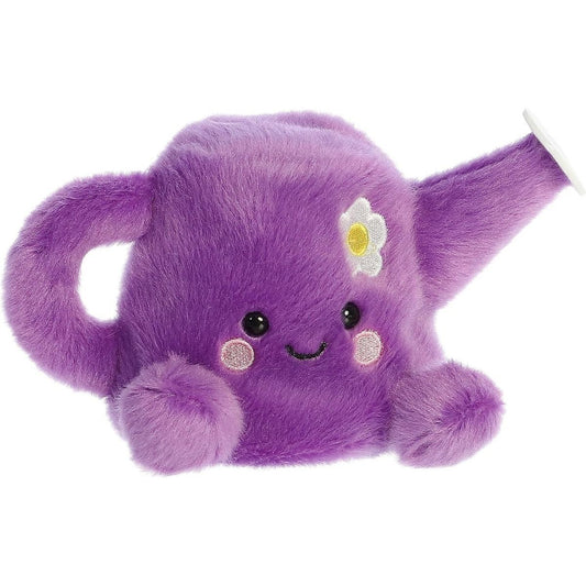 Aurora 5-inch Palm Pals Flo Watering Can plush toy sitting at an angle showing its vibrant purple body, curved handle, long spout with a white tip, and a small white daisy accent.
