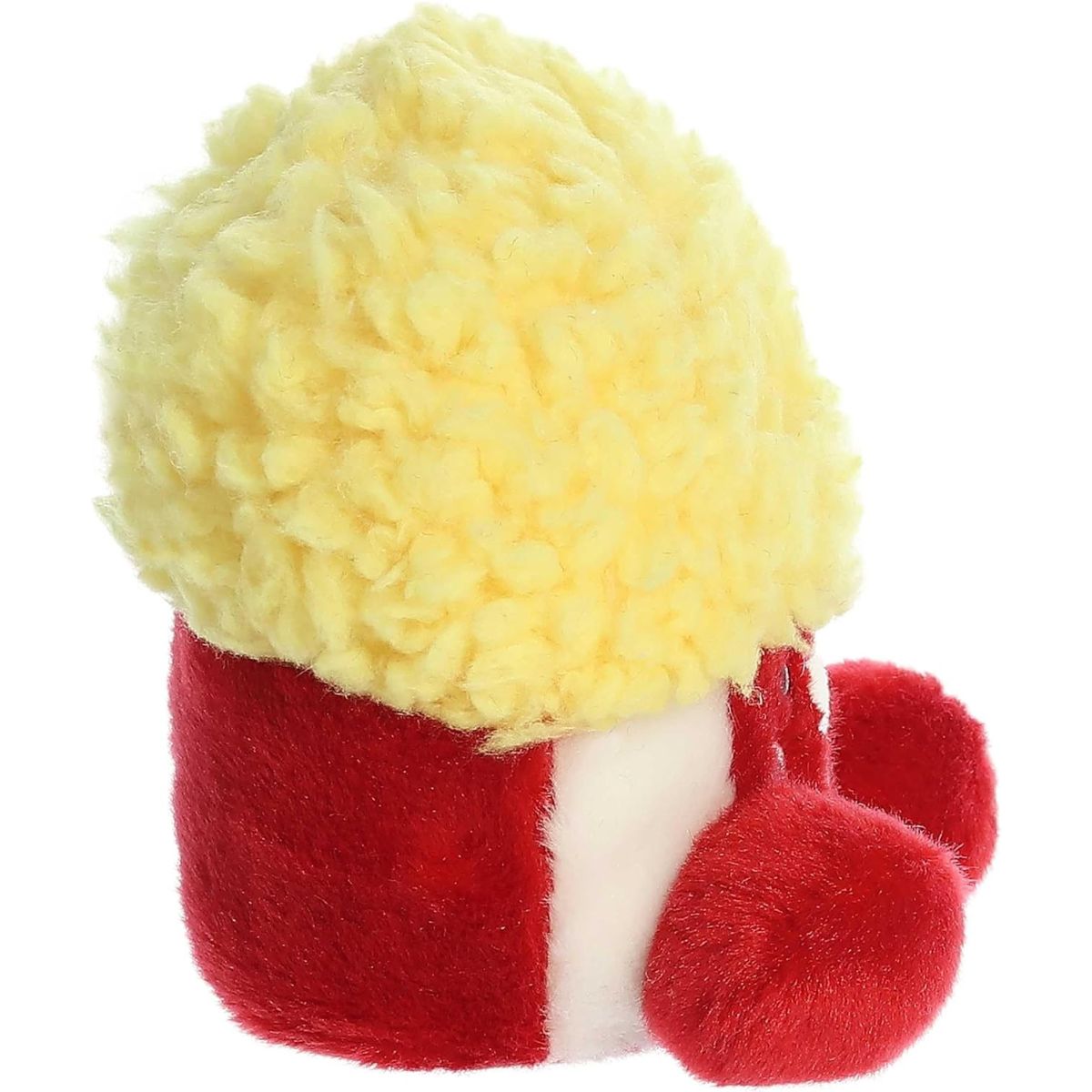 Side profile view of the Palm Pals Popcorn plush highlighting its perfectly squishy body, red and white stripes, and textured yellow top.