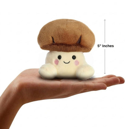 The miniature Umami Shiitake Mushroom plush sitting balanced in an open human hand under a 5-inch height graphic indicator.