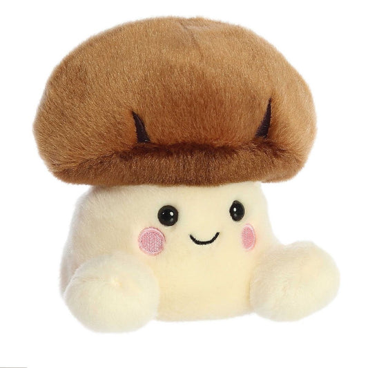 Aurora 5-inch Palm Pals Umami Shiitake Mushroom plush toy showing its smooth golden-brown cap, cream stem base, dark safety eyes, and a happy stitched smile with rosy cheeks.