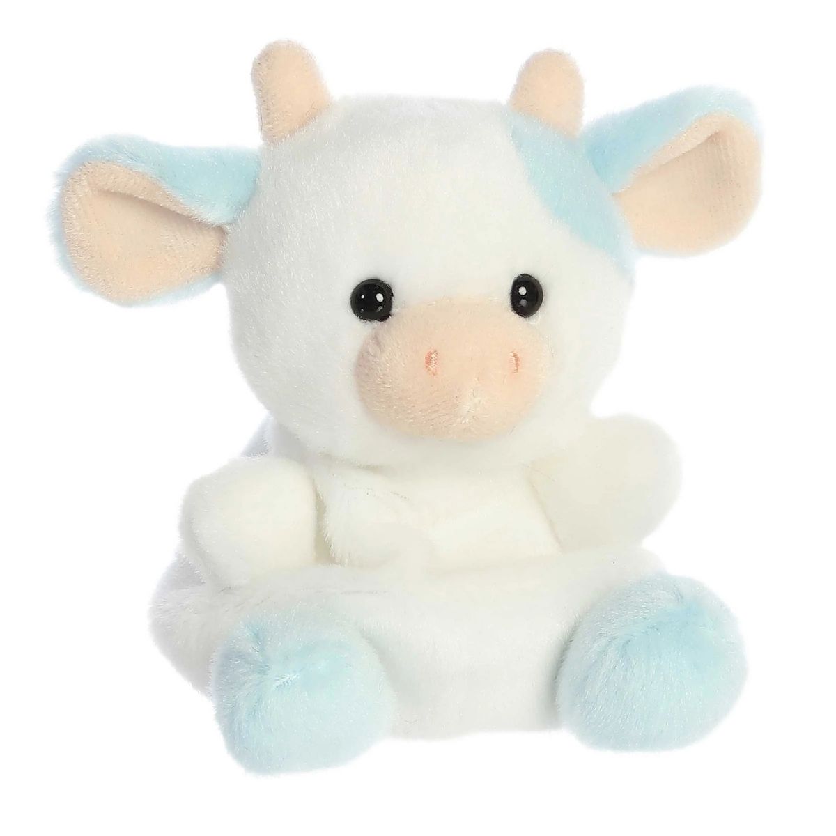 Aurora 5-inch Palm Pals Skyla Blueberry Cow plush toy sitting forward showing its white body, pastel blue eye patch and ears, peach horns, and a soft cream muzzle.