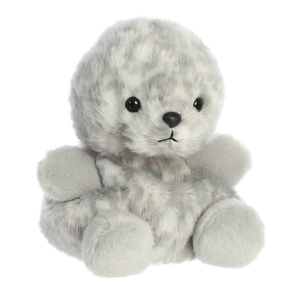 Angled view of the Aurora Palm Pals 5-inch Marina Harbor Seal plush sitting upright, showing its mottled grey fur and front flippers.