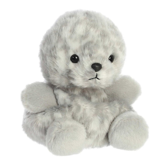 Angled view of the Aurora Palm Pals 5-inch Marina Harbor Seal plush sitting upright, showing its mottled grey fur and front flippers.