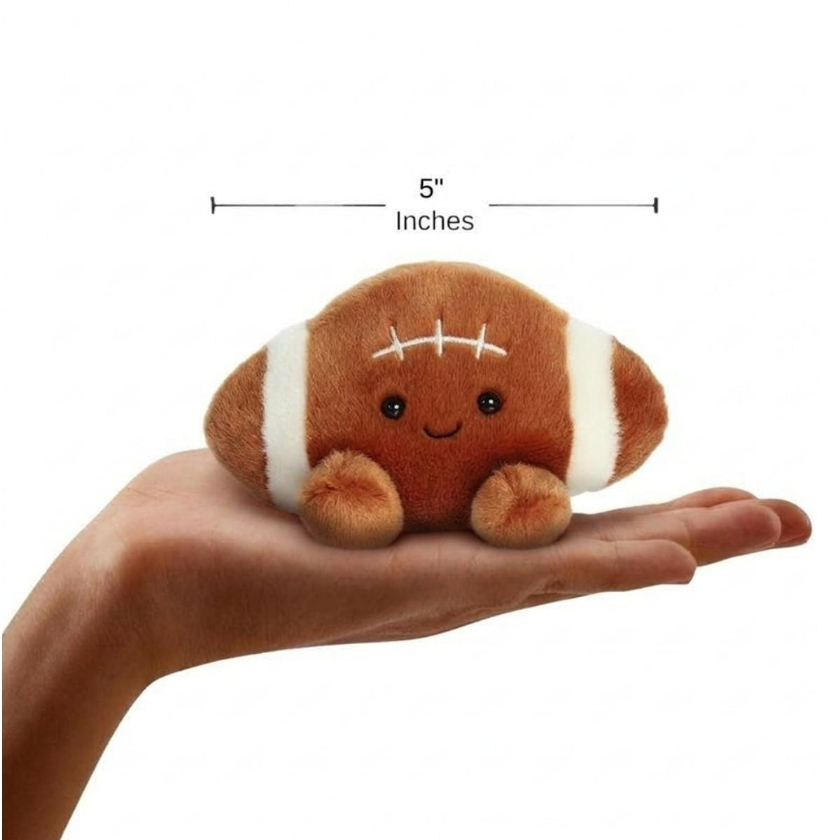 The miniature Tackle Football plush sitting balanced in an open human hand under a 5-inch height graphic indicator.