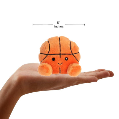 Sizing graphic for the Aurora Palm Pals Hoops Basketball plush showing it sitting perfectly in the palm of a hand, indicating a total height of 5 inches.