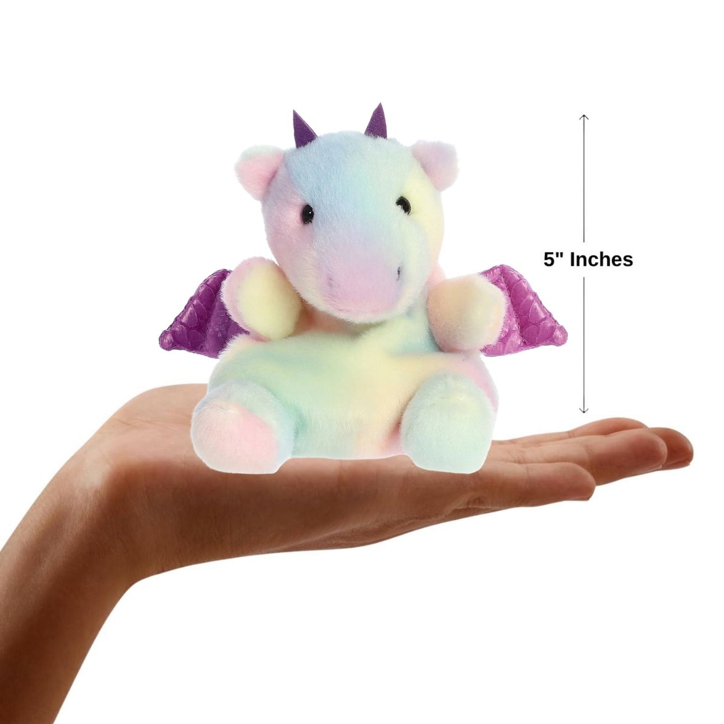 Small unicorn plush toy held in a hand with a measurement label indicating 5 inches.