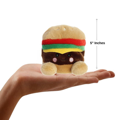 Sizing graphic for the Aurora Palm Pals Charles Cheeseburger plush showing it sitting perfectly in the palm of a hand, indicating a total height of 5 inches.