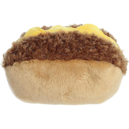 Rear view thumbnail of the Aurora cheesesteak stuffed toy displaying its smooth, solid tan plush hoagie backing and dark steak top line.