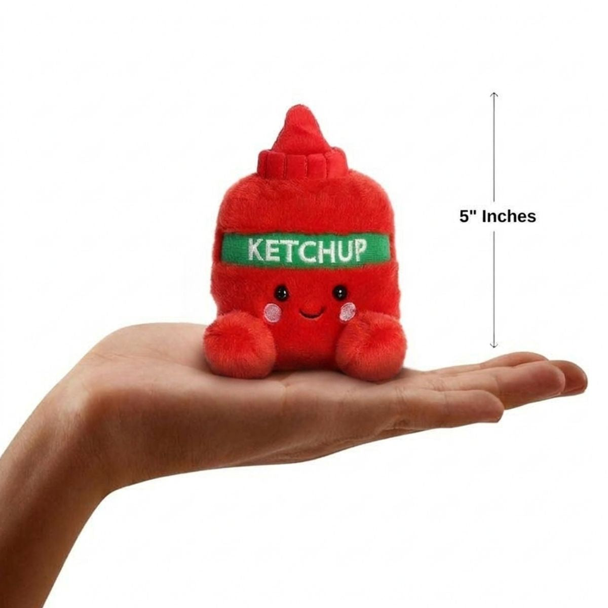 The miniature Tommy Ketchup plush sitting balanced in an open human hand under a 5-inch height graphic indicator.