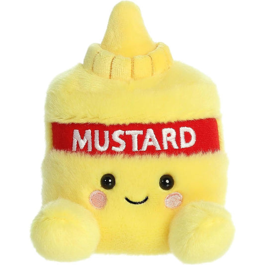 Front view of the adorable Aurora Newton Mustard stuffed animal featuring a sweet smile, rosy pink cheeks, dark eyes, and a bold red label.
