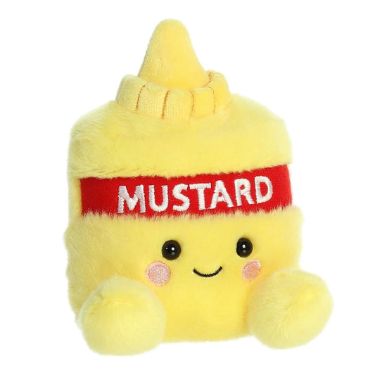 Angled view of the Aurora Palm Pals 5-inch Newton Mustard plush sitting upright, showing its yellow bottle shape, red mustard label, and little feet.