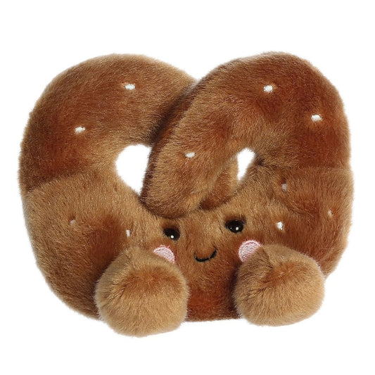 Aurora 5-inch Palm Pals Twist Pretzel plush toy showing its golden-brown knotted body, white embroidered salt crystals, and a sweet smiling face with blushing cheeks.