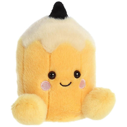 Aurora 5-inch Palm Pals Tike Pencil plush toy showing its cylindrical yellow body, cream shaved-wood cone top, black pointed tip, and a sweet smiling face with blushing cheeks.
