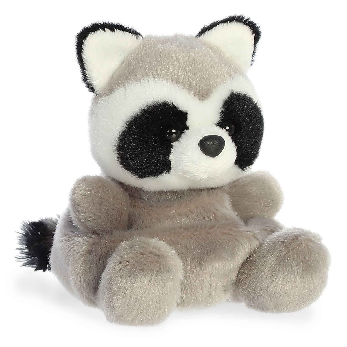 Angled view of the Aurora Palm Pals 5-inch Rascal Raccoon plush sitting upright, showing its grey fur, black bandit mask, and white muzzle.
