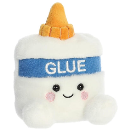Aurora 5-inch Palm Pals Doodle Gooey Glue plush toy showing its white bottle shape, orange twist nozzle cap, blue label with white "GLUE" embroidery, and a cute smiling face.