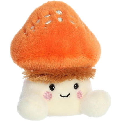 Aurora 5-inch Palm Pals Fabian Fluffy Mushroom plush toy showing its bright orange cap with cream spots, shaggy brown fur collar, cream stem body, and sweet smiling face.