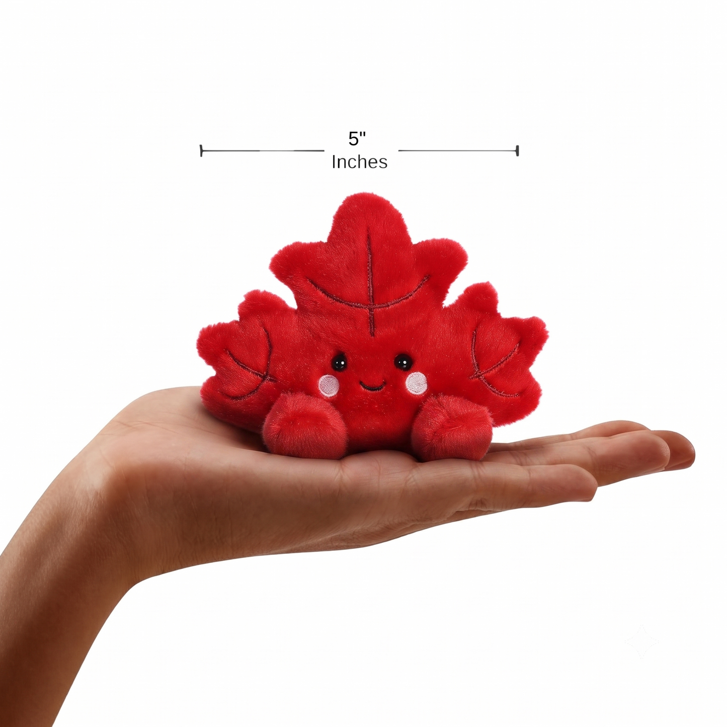 The miniature Fall Maple Leaf plush sitting balanced in an open human hand under a 5-inch width graphic indicator.