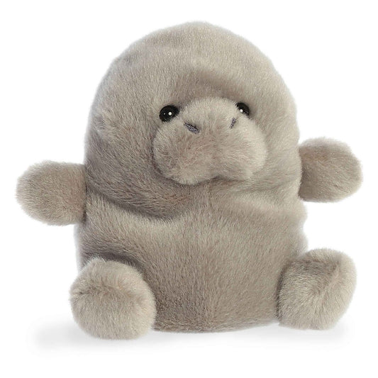 Angled view of the Aurora Palm Pals 5-inch Blubs Manatee plush sitting upright, showing its soft grey fur, rounded snout, and small flippers.