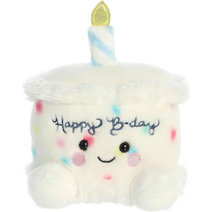 Straight-on front view of the soft white Palm Pals birthday cake plush featuring colorful sprinkles and "Happy Bday" embroidery.