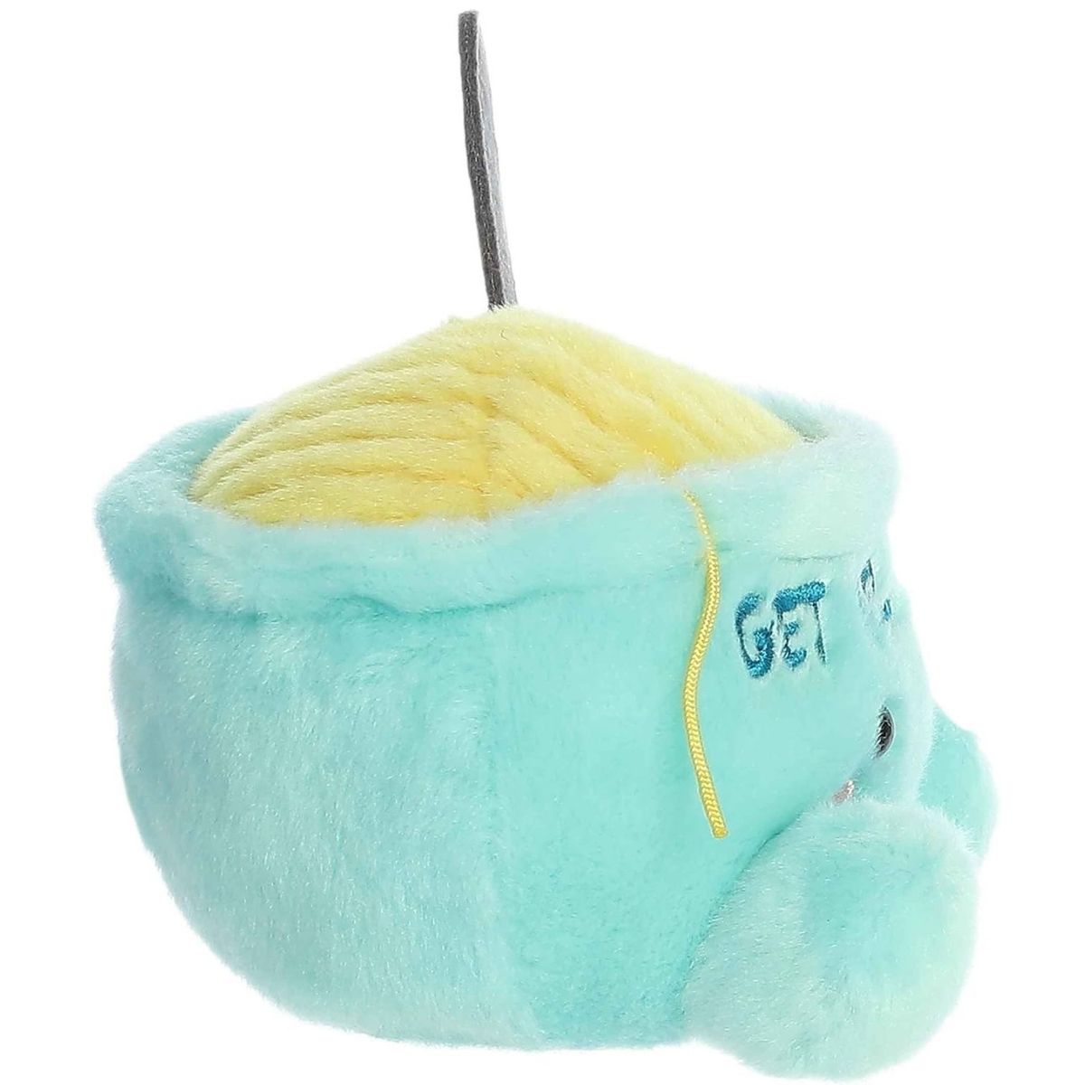 Side profile thumbnail of the mini soup bowl plush showcasing its rounded depth, upright gray spoon, and the side profile of the embroidered text.