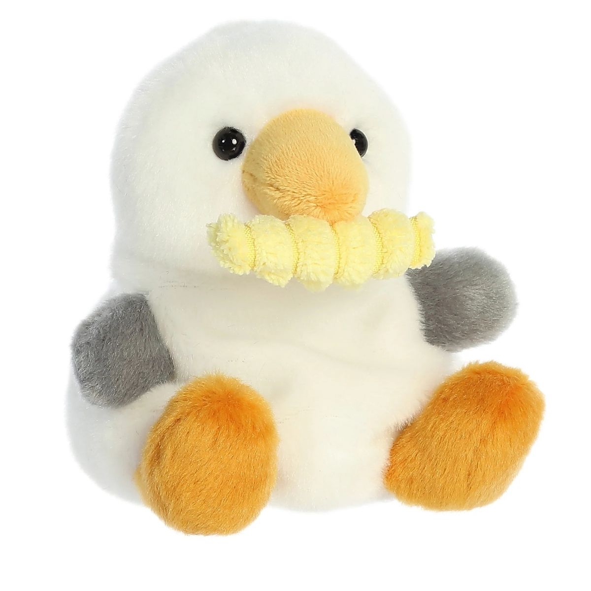Aurora 5-inch Palm Pals Buoy Seagull with Fry plush toy showing its white body, gray wings, orange beak, and a yellow crinkle-cut french fry clamped in its mouth.