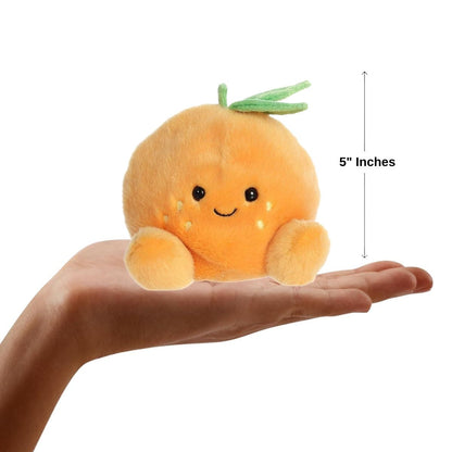 Sizing graphic for the Aurora Palm Pals Tangie Orange plush showing it sitting perfectly in the palm of a hand, indicating a total height of 5 inches.