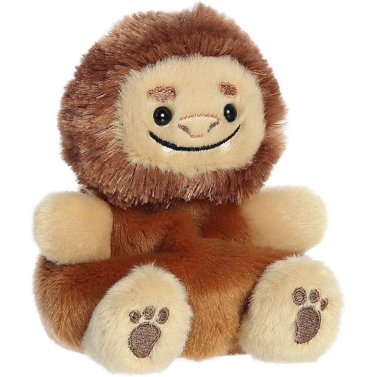 Aurora 5-inch Palm Pals Brock Big Foot plush toy sitting forward showing its warm brown body, shaggy dark brown fur mane, tan face, and big feet with embroidered paw pads.