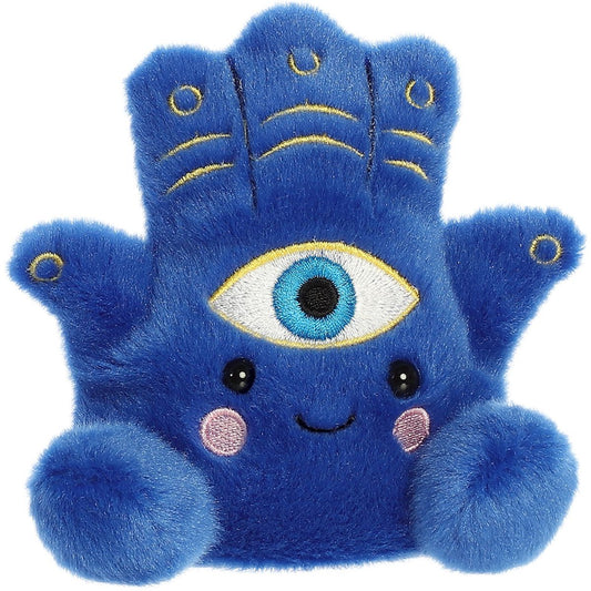 Angled view of the Aurora Palm Pals 5-inch Farah Hamsa plush sitting upright, showing its deep blue color, central eye, and sweet smiling face.