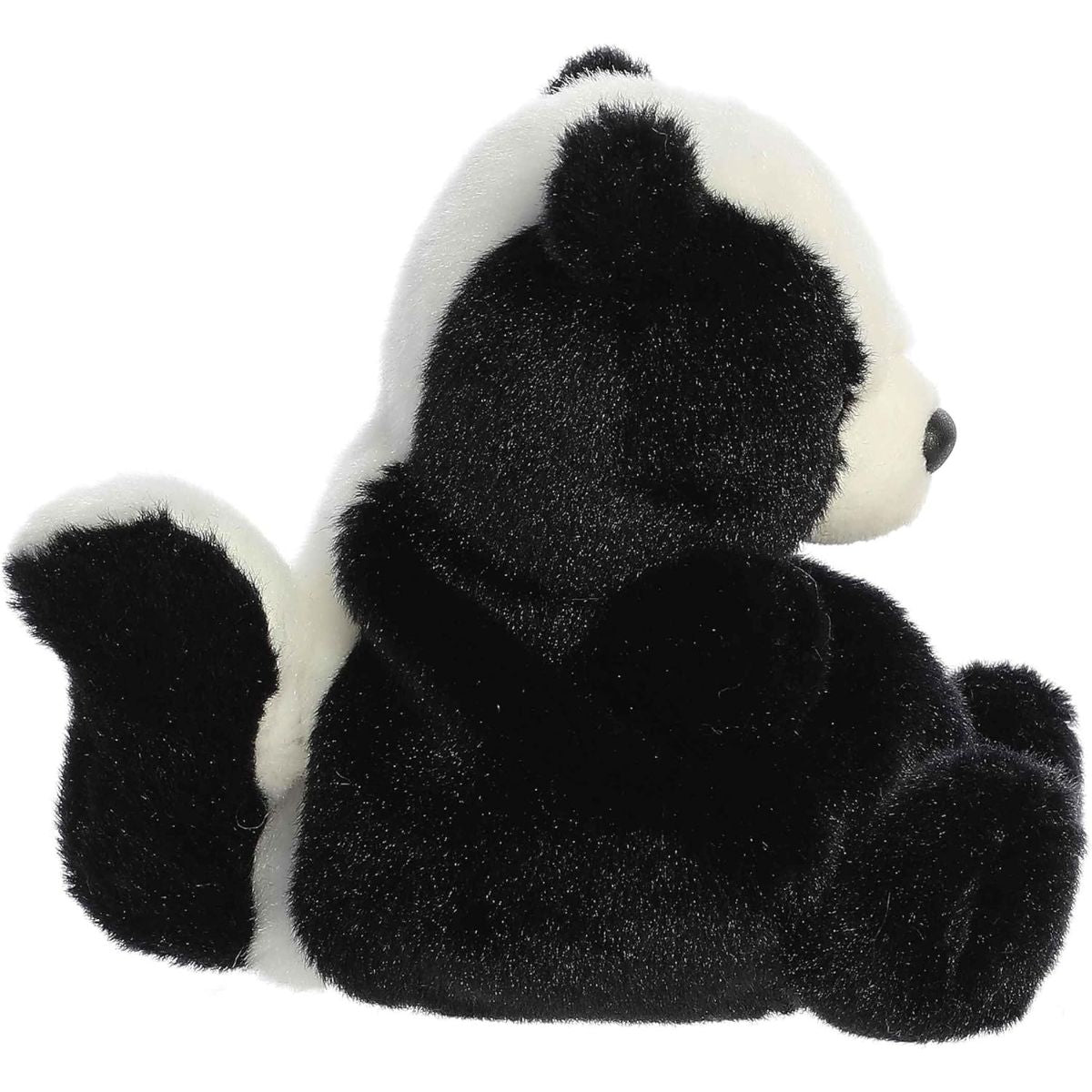 Side profile thumbnail of the mini skunk plush showcasing its upright posture and fluffy black and white tail curved upwards.