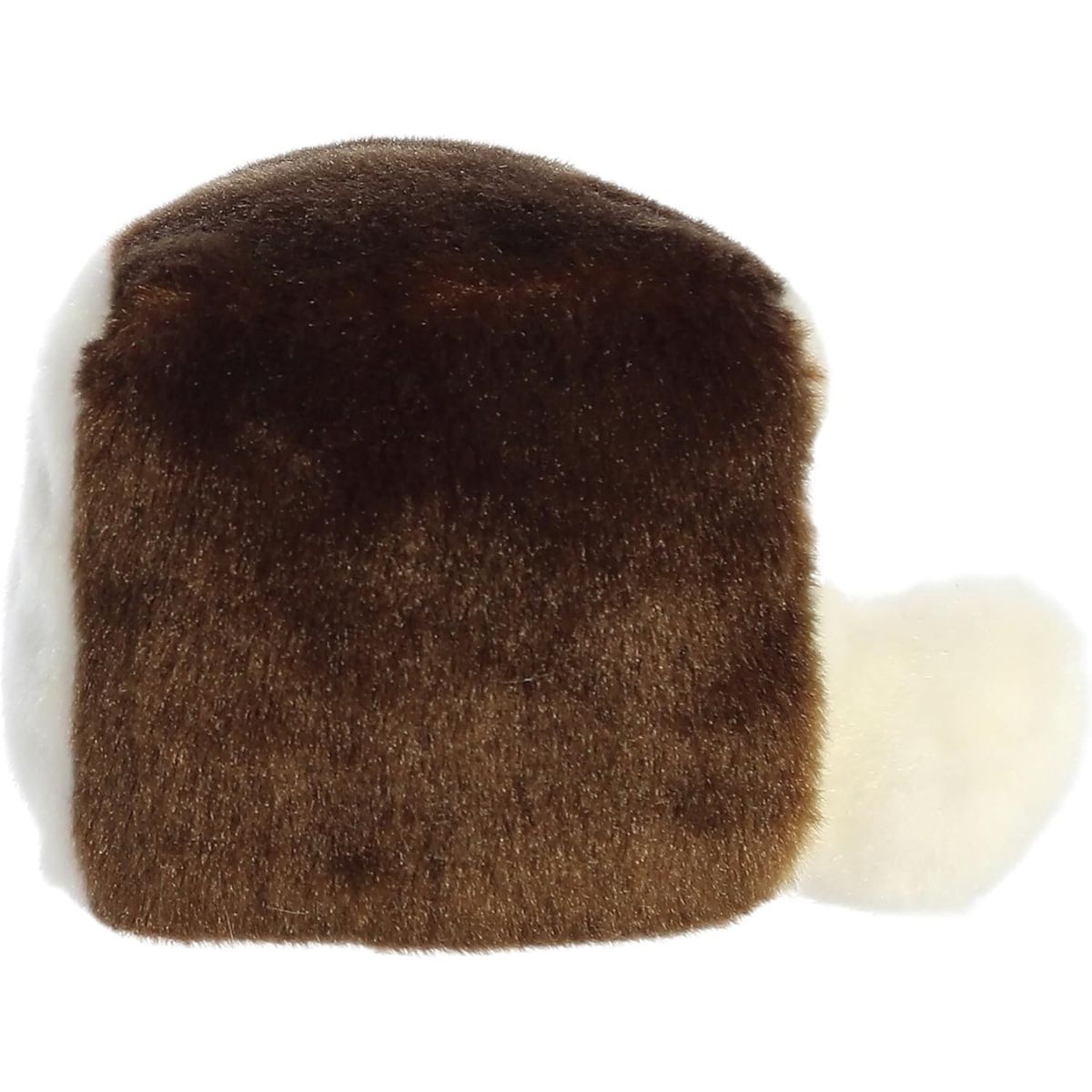 Side profile view of the cuddly Palm Pals cake slice stuffed animal showing the white frosting side and round shape.