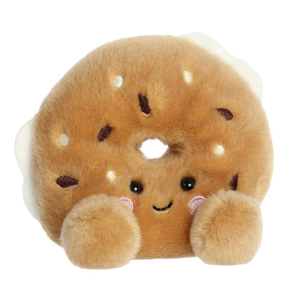 Aurora Palm Pals Tony Everything Bagel 5-inch plush stuffed toy sitting forward with a golden-brown ring body and a sweet smiling face.