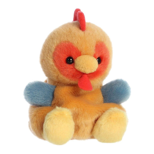 Aurora Palm Pals Red Rooster 5-inch plush stuffed toy sitting forward with a golden-brown body, slate-blue wings, and a red comb.