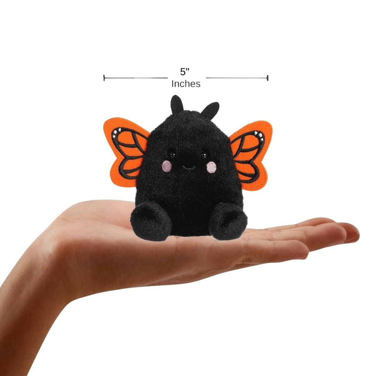 The miniature Reyna Monarch Butterfly plush sitting inside an open human hand displaying a 5-inch width indicator graphic.