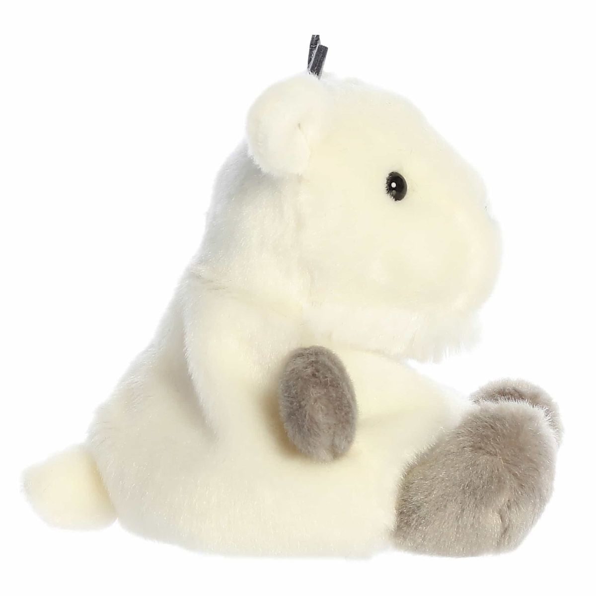 The right side view of the sitting Aurora Palm Pals mountain goat plush highlighting its plump shape and soft cream coat.