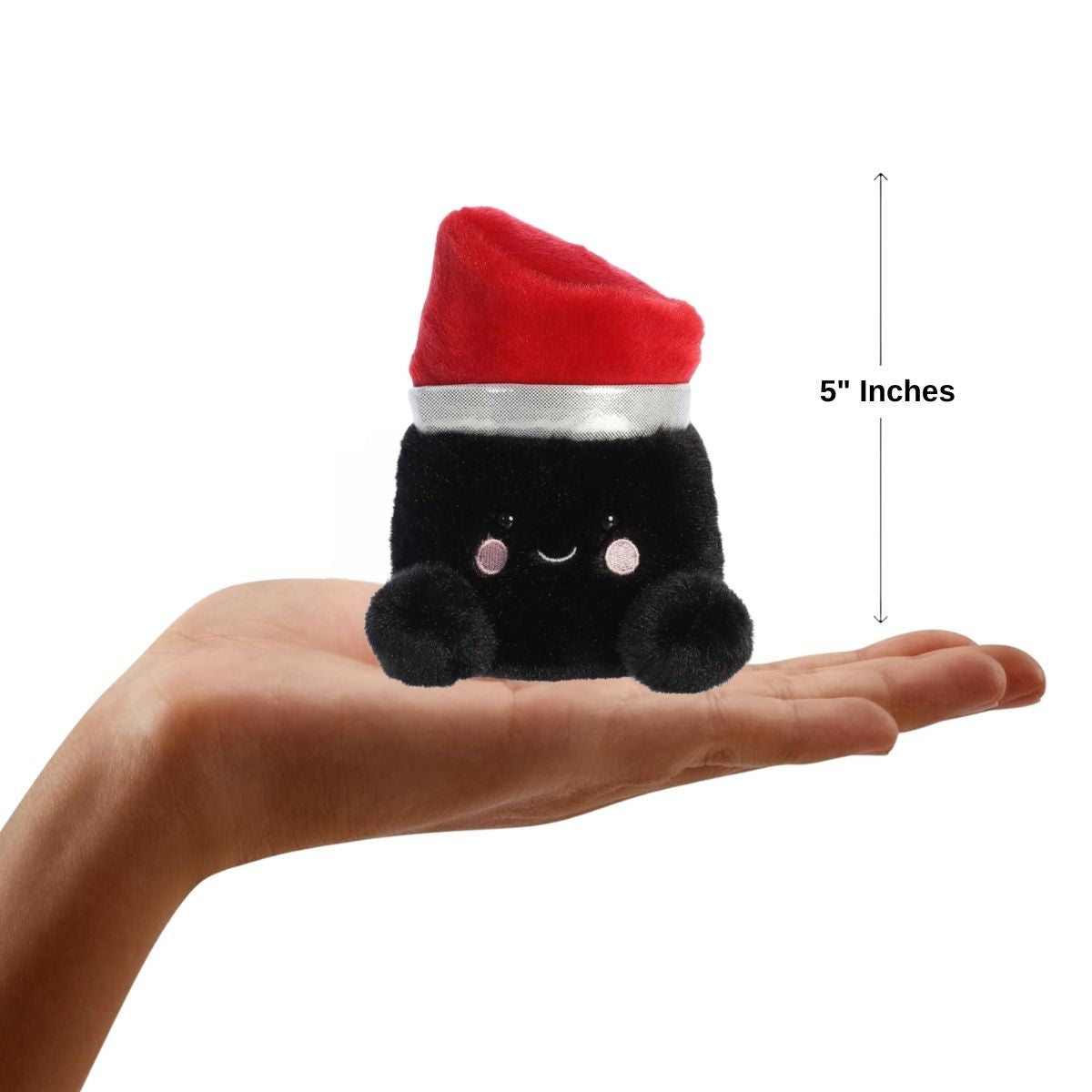 Front view of the mini lipstick plush sitting balanced on a human hand with a dimension line indicating its 5-inch height.