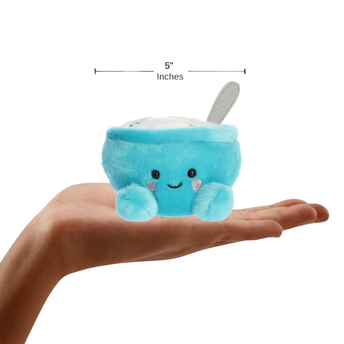 Front view of the mini cereal bowl plush sitting balanced on a human hand with a dimension line indicating its 5-inch height.