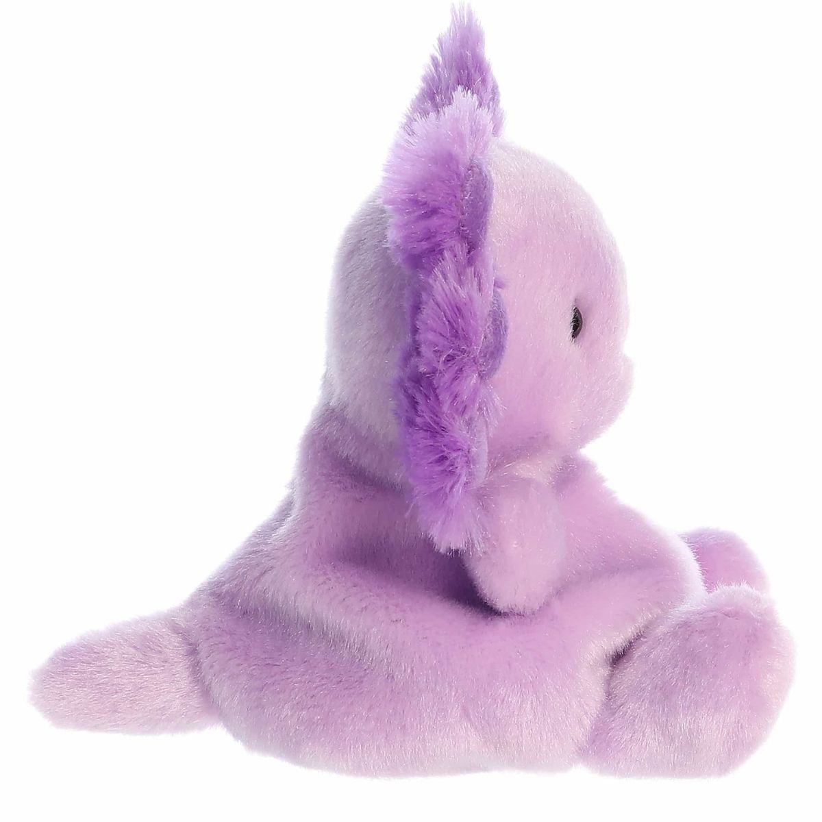 Right side profile view of the lavender axolotl plush showing its rounded head, fluffy external gills, and extended flat tail.
