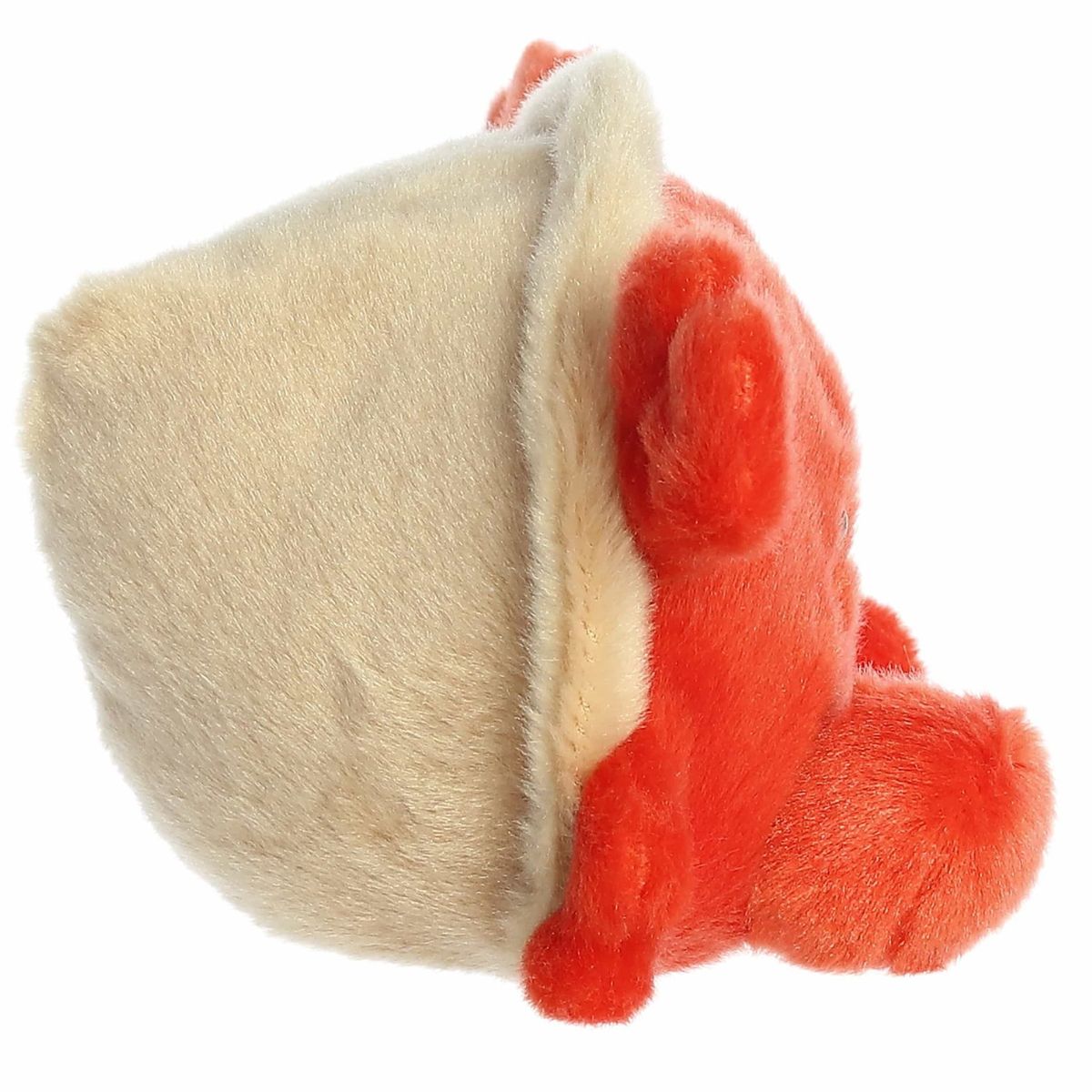 The right side view of the sitting Aurora Palm Pals hermit crab plush highlighting its soft beige shell encasing its back.